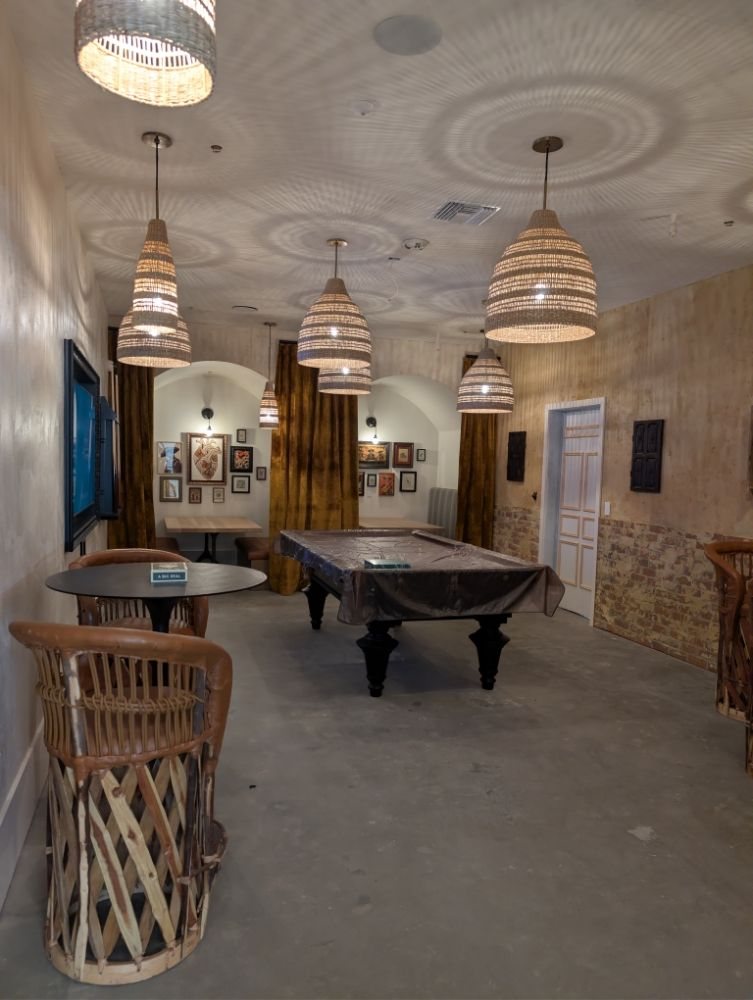 Billiards room with pendant lights