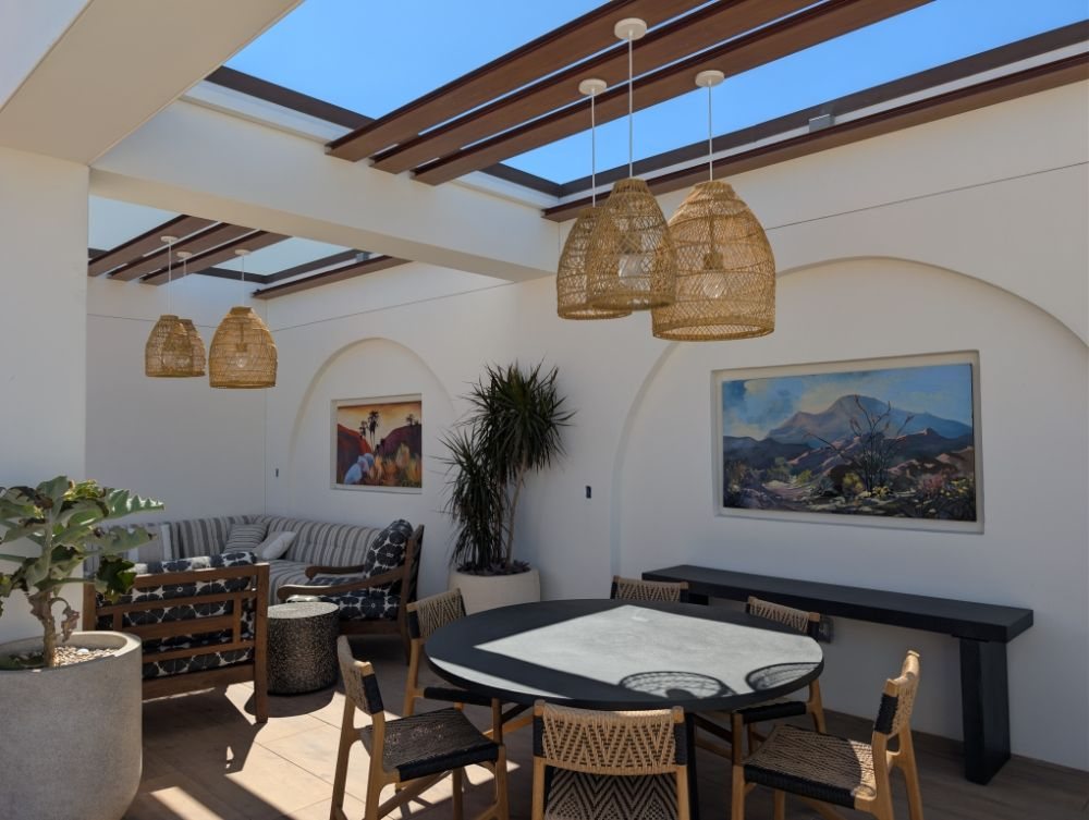 A clubhouse lounge with skylights and pendant lighting wired by Galarza Electric