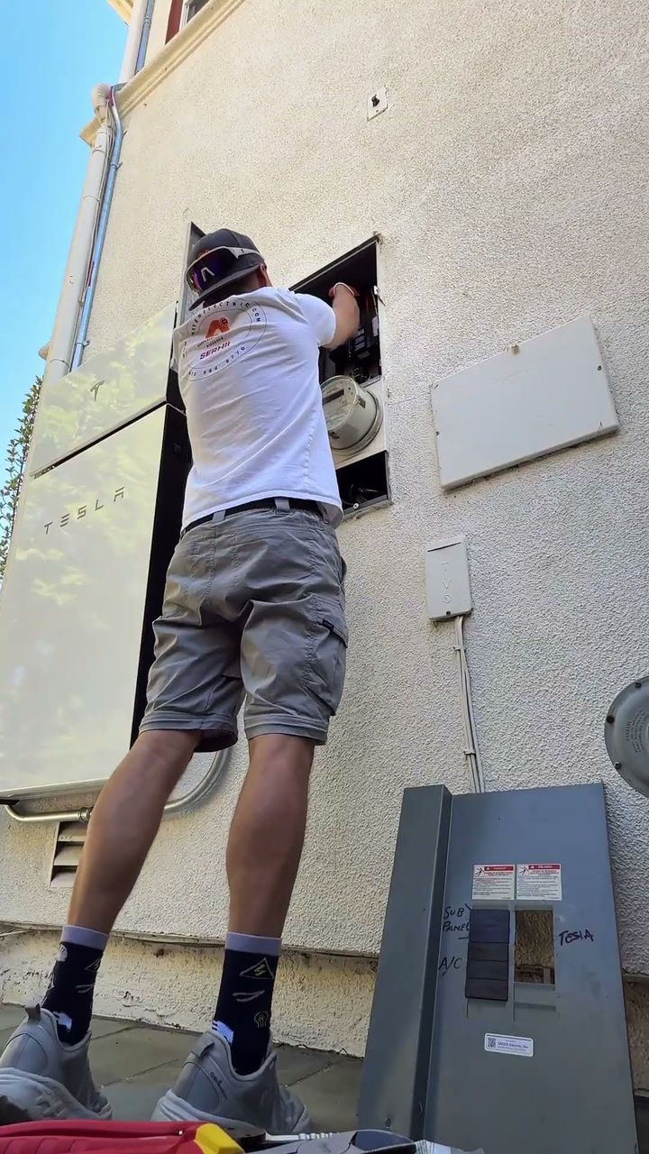 Plug and Go Electrics working on an exterior electrical panel