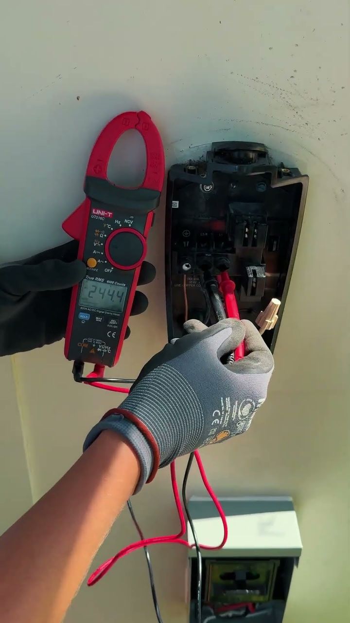 Clamp meter testing at a panel